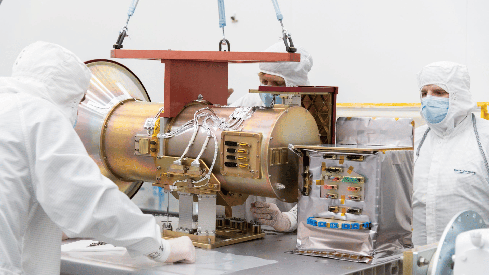 SDL Engineer and Scientist Brian Thompson, Engineering Associate Dave Griffin, and Mission Assurance Manager Russ Kirkham pictured mounting the AWE Opto-Mechanical Assembly to the flight EXPRESS Payload Adapter at SDL facilities